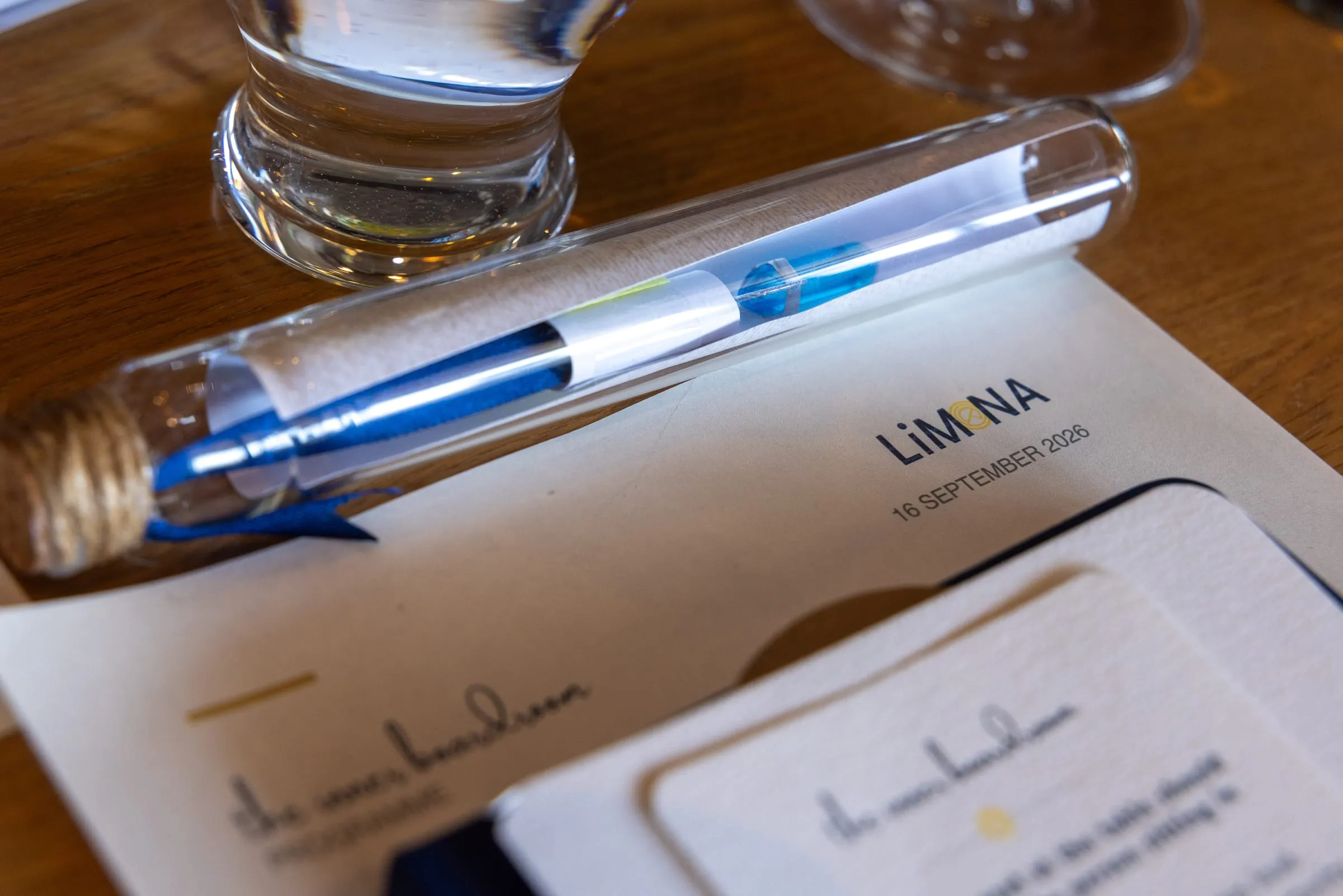 A LiMona pen resting on a place card