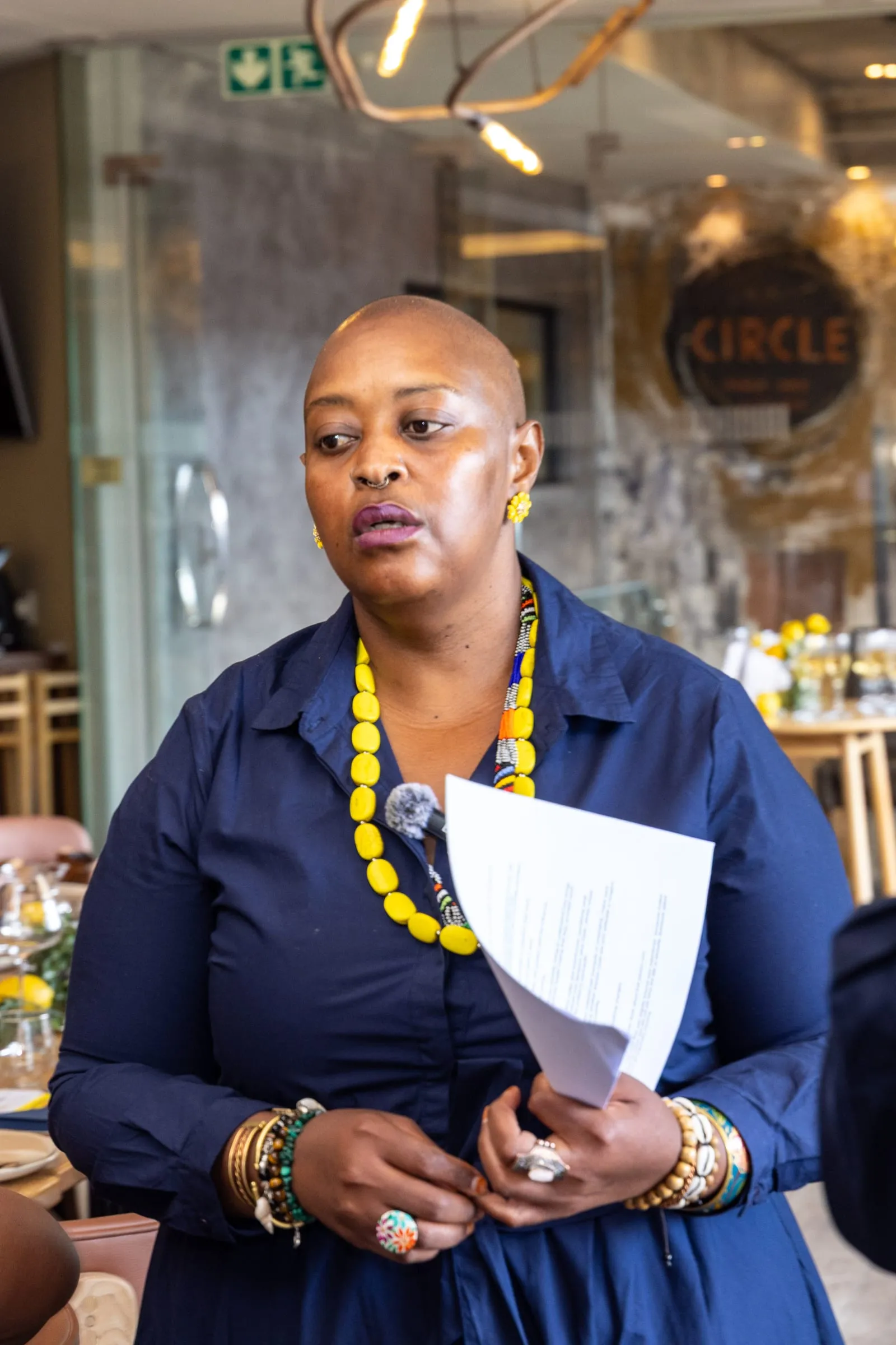 The host opens the conversation, notes in hand
