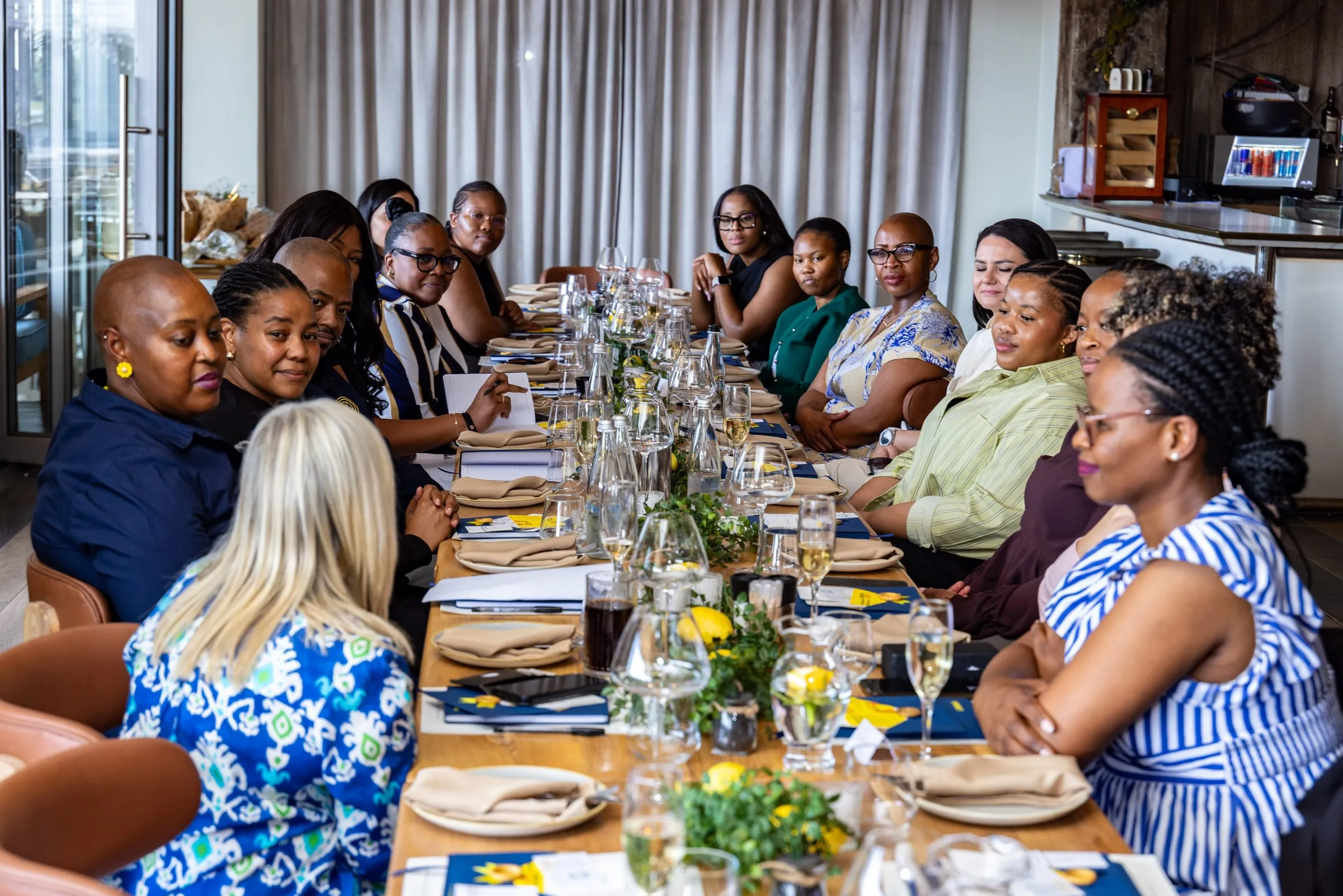 Guests gathered along the full length of the lunch table