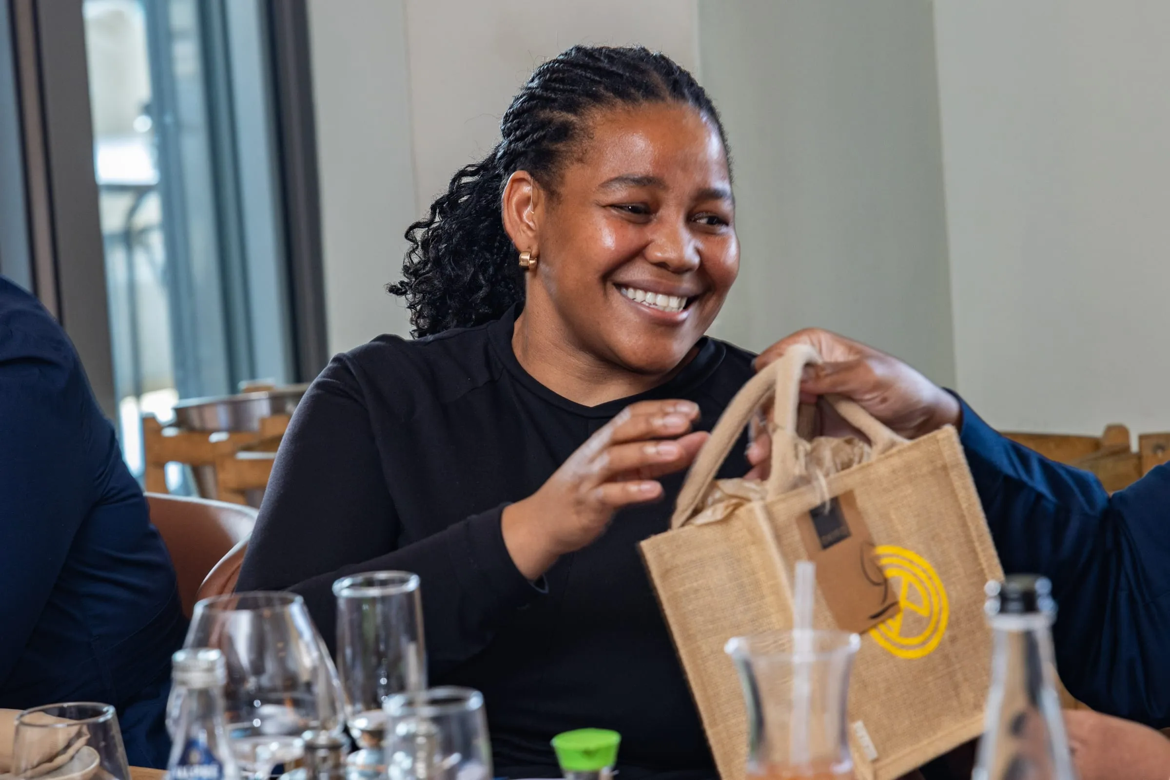 A guest opens her gift bag
