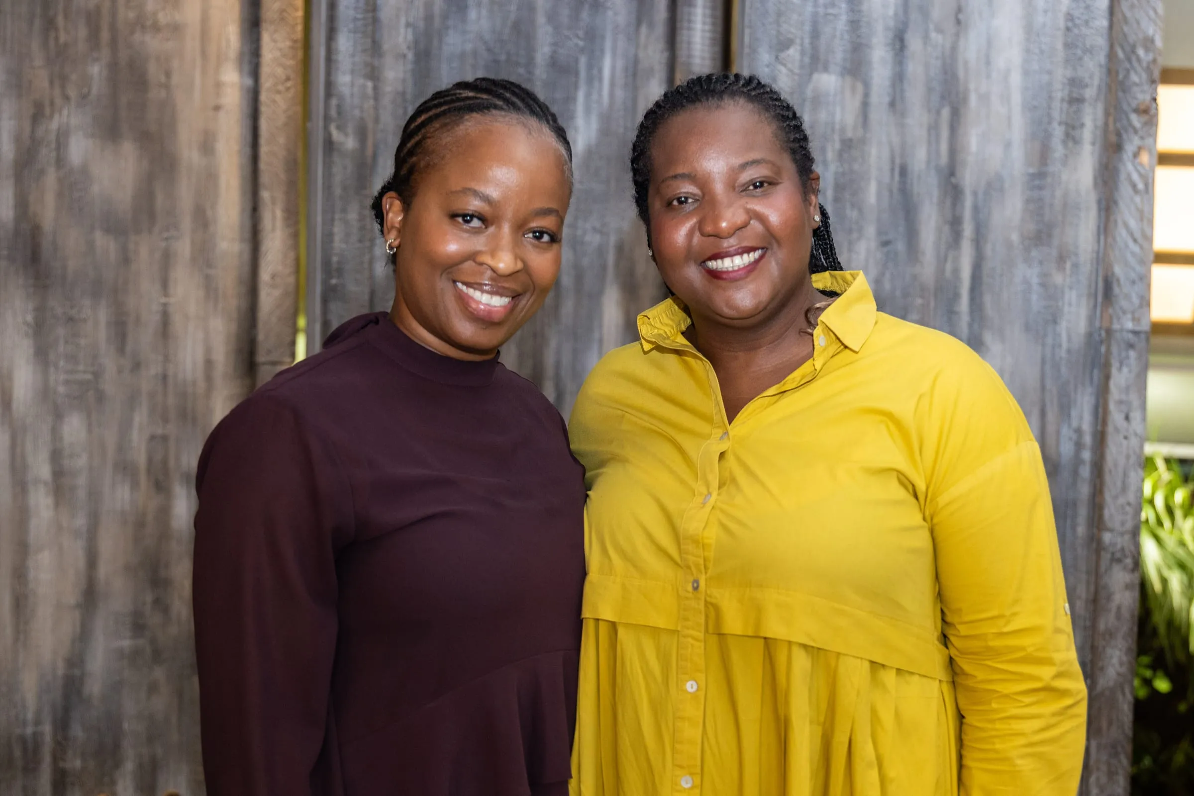 Two guests pose side by side