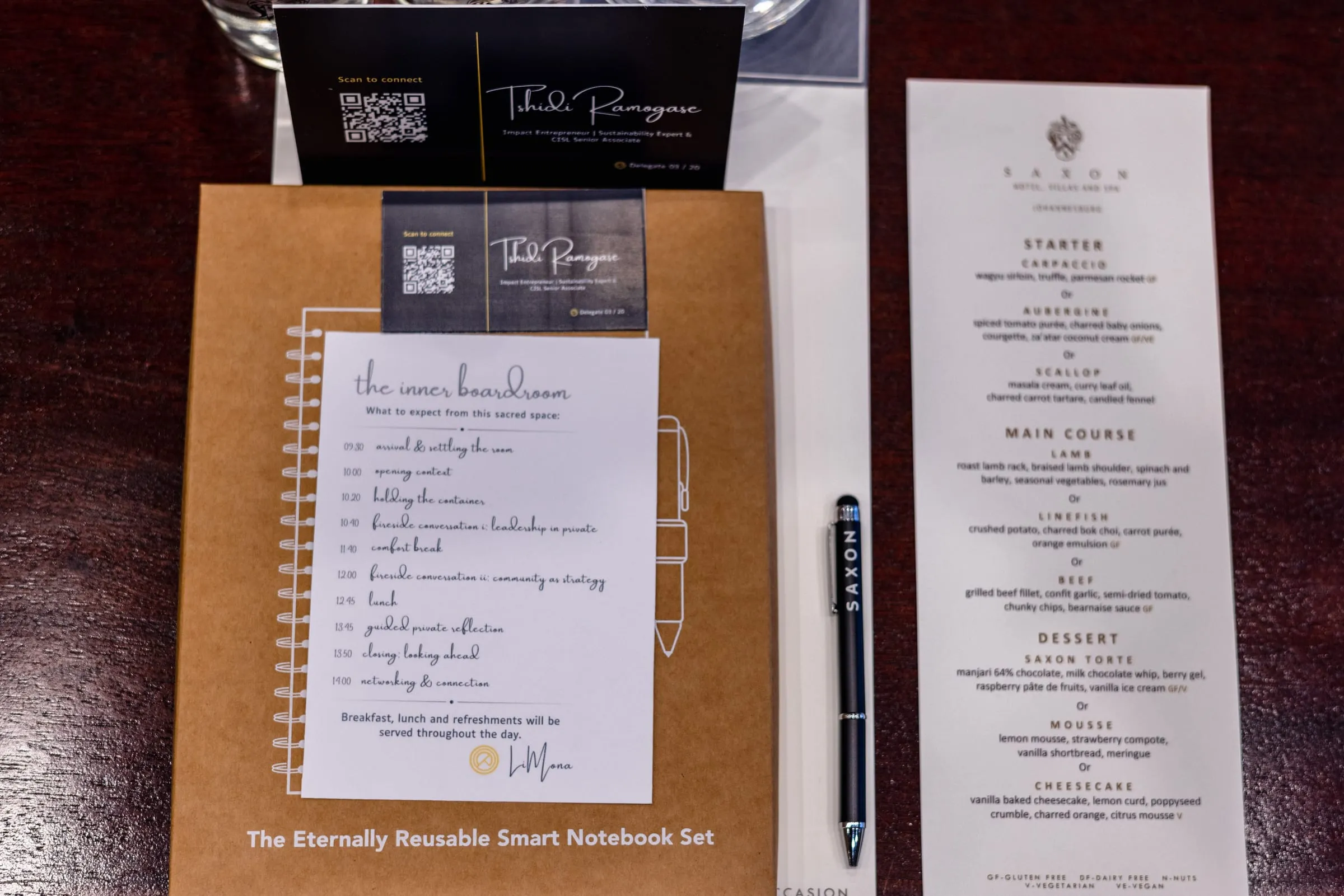A notebook and menu at a place setting