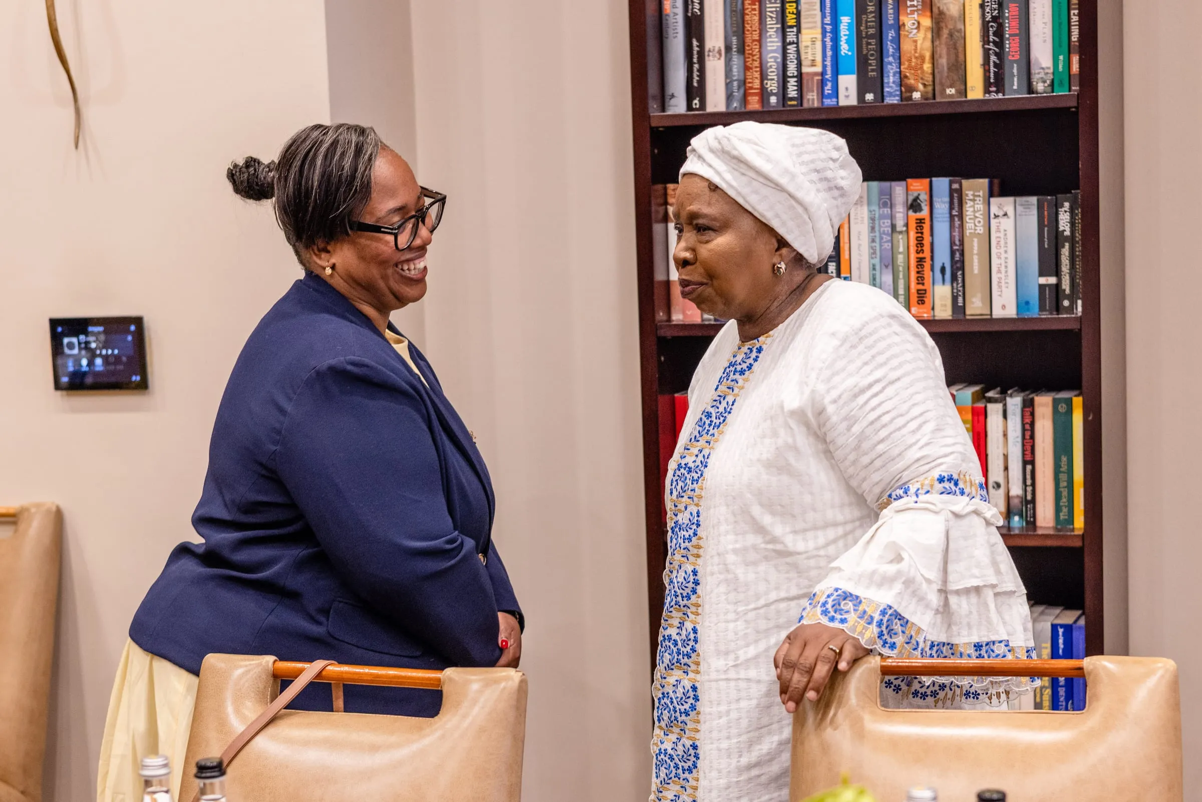 Guests greet each other in the library