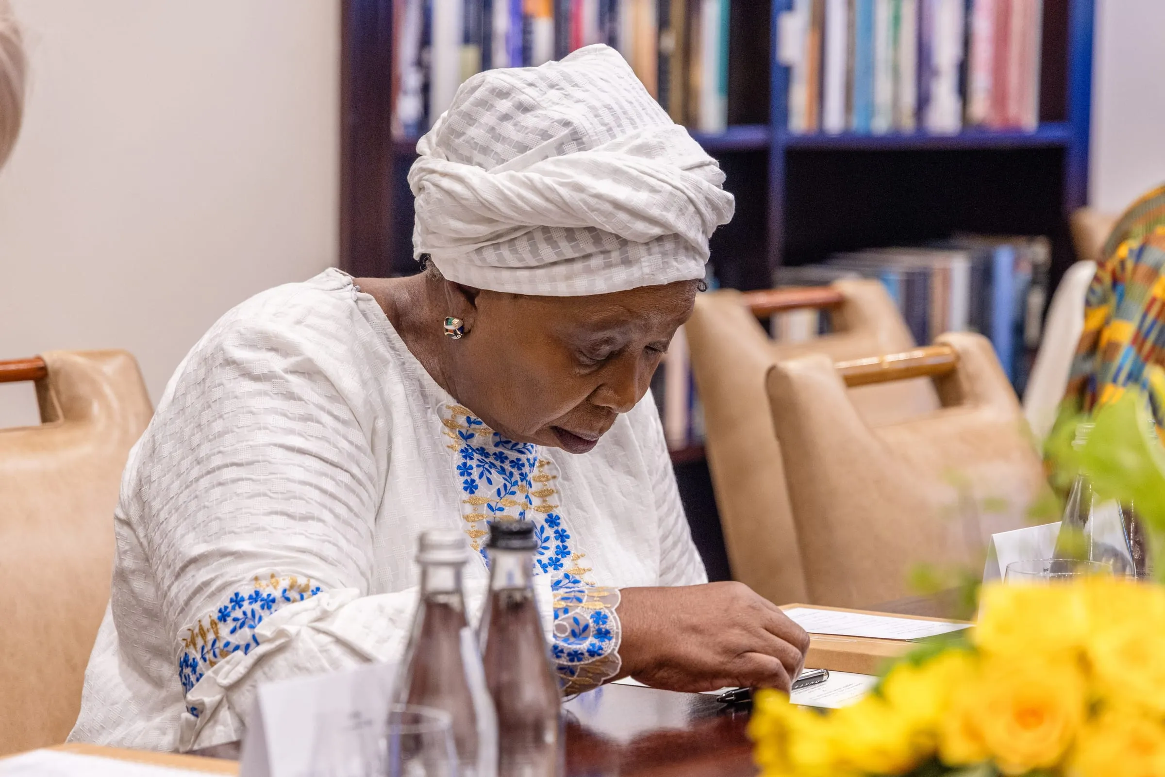 A guest listens at the table