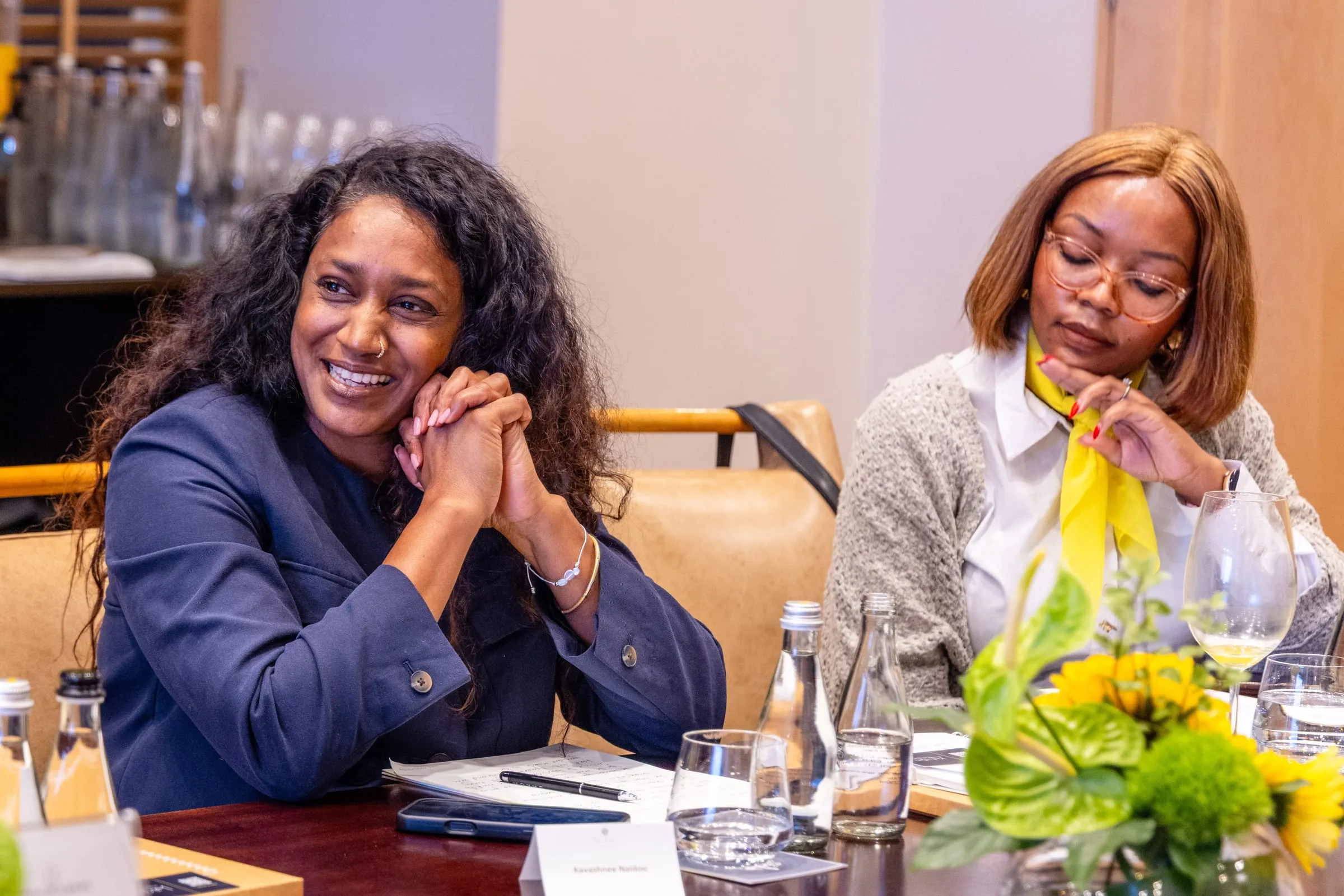Two guests share a laugh
