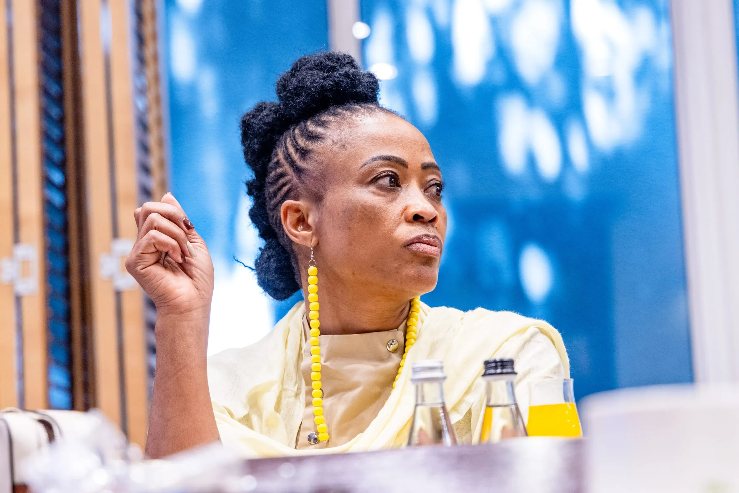 A guest gestures as she speaks